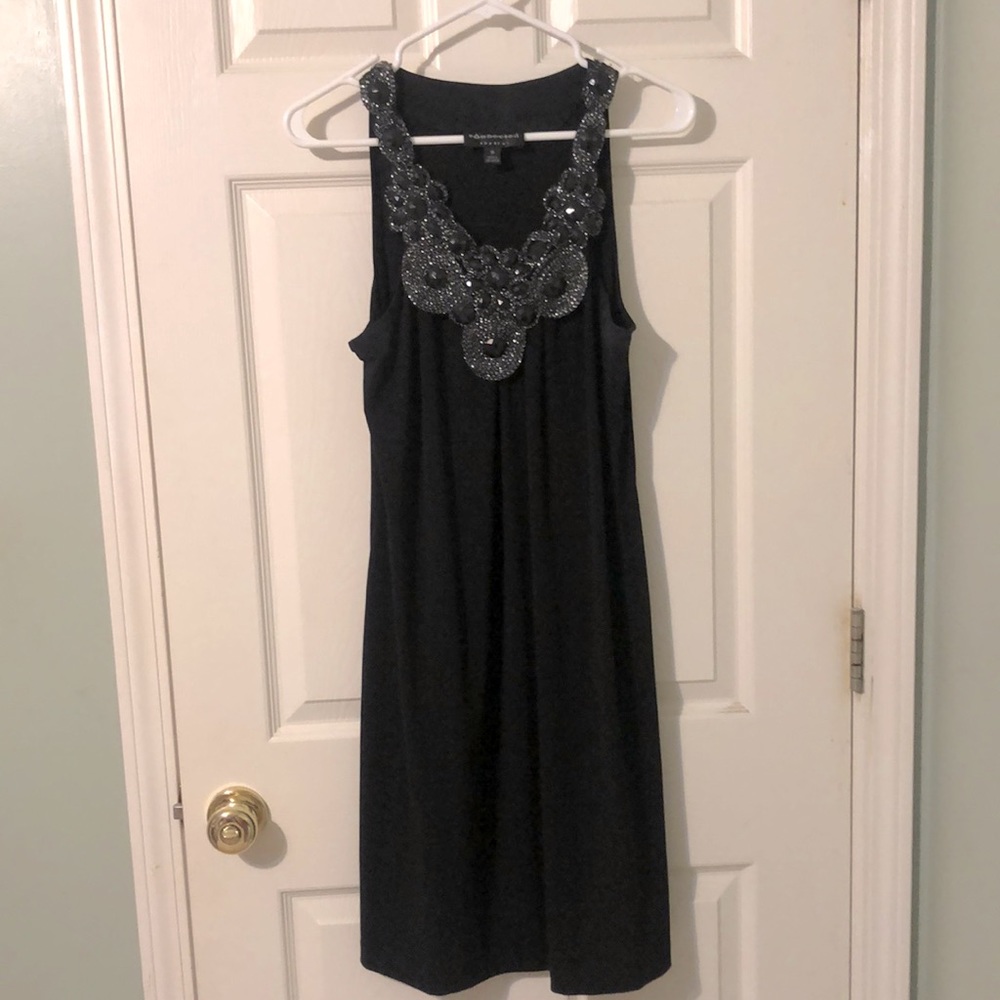 Black dress with statement neck beaded detail. 10.